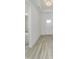 View of a bright entryway with light-colored wood flooring and a white front door at 14844 Higgins Dr, Westfield, IN 46074