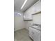 Laundry room features gray tile flooring, granite countertops and white cabinets at 14844 Higgins Dr, Westfield, IN 46074
