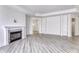 Bright living room with fireplace, built-in shelves, and a glimpse into other rooms at 14844 Higgins Dr, Westfield, IN 46074