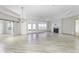 Large living room features tray ceiling, barn doors, sliding glass doors to patio, and fireplace at 14844 Higgins Dr, Westfield, IN 46074