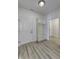 Mud room with wood-look flooring, storage bench and coat hooks, and access to the garage at 14844 Higgins Dr, Westfield, IN 46074