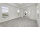 Bright room with neutral paint, white trim, plush carpet, and an open doorway at 14844 Higgins Dr, Westfield, IN 46074