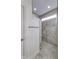 Bright walk-in shower features marble tile and a glass paneled half wall at 14844 Higgins Dr, Westfield, IN 46074