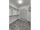 Empty walk-in closet with adjustable shelving, neutral paint, and carpet at 14844 Higgins Dr, Westfield, IN 46074