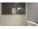 Bathroom walk-in shower with black and white tiles at 1512 Bellefontaine St, Indianapolis, IN 46202