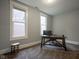 Bedroom featuring two windows and a work desk at 1512 Bellefontaine St, Indianapolis, IN 46202