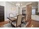 Spacious dining room with hardwood floors and a view into the kitchen and other living spaces at 1512 Bellefontaine St, Indianapolis, IN 46202