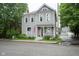 Charming gray two-story home featuring a cozy front porch and well-maintained landscaping at 1512 Bellefontaine St, Indianapolis, IN 46202