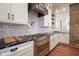 Gourmet kitchen featuring high-end appliances, granite countertops, and custom cabinetry at 1512 Bellefontaine St, Indianapolis, IN 46202