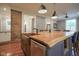 Kitchen with a large island with seating, a copper sink, and stainless steel appliances at 1512 Bellefontaine St, Indianapolis, IN 46202