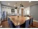 Spacious kitchen with a large wooden island, stainless steel appliances, and open layout at 1512 Bellefontaine St, Indianapolis, IN 46202
