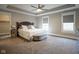 Spacious main bedroom featuring tray ceilings, neutral carpet, and a sitting area at 1512 Bellefontaine St, Indianapolis, IN 46202