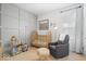 Cozy Bedroom with crib, comfortable armchair, soft lighting, and charming decor at 1655 Avondale Dr, Westfield, IN 46074
