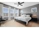 Bedroom with a ceiling fan, large windows, and a king bed for a peaceful retreat at 1655 Avondale Dr, Westfield, IN 46074