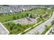 Aerial view of a community park featuring a playground, picnic area, and walking paths at 1655 Avondale Dr, Westfield, IN 46074