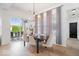 Bright dining room with a view of the backyard, featuring a modern light fixture at 1655 Avondale Dr, Westfield, IN 46074