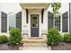 Inviting front entry with gray door, decorative wreath, and dual chairs at 1655 Avondale Dr, Westfield, IN 46074