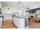 Open-concept kitchen and living room with modern appliances and island at 1655 Avondale Dr, Westfield, IN 46074