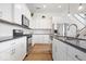 Stylish kitchen with white cabinets, stainless steel appliances, and island seating at 1655 Avondale Dr, Westfield, IN 46074