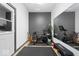 Home gym featuring a Peloton bike, mirror and exercise mat for convenient fitness at 1655 Avondale Dr, Westfield, IN 46074