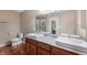 Bathroom featuring double sinks, granite countertops, and a glass-enclosed shower at 16956 Fulton Pl, Westfield, IN 46074