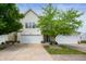 Charming home featuring a two-car garage, well-maintained lawn, and mature trees at 16956 Fulton Pl, Westfield, IN 46074
