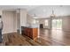 Kitchen with a breakfast bar that overlooks the living area with hardwood floors at 16956 Fulton Pl, Westfield, IN 46074