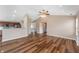 Bright and open living area featuring hardwood floors, fireplace, and seamless access to the kitchen at 16956 Fulton Pl, Westfield, IN 46074