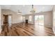 Large living area with fireplace, sliding glass doors to a deck, and hardwood floors at 16956 Fulton Pl, Westfield, IN 46074