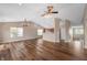 Spacious living room featuring high ceilings, hardwood floors, and an abundance of natural light at 16956 Fulton Pl, Westfield, IN 46074