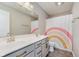 Bright bathroom featuring a double sink vanity, a toilet, and a curtained shower at 1715 Foudray S Cir, Avon, IN 46123