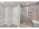 Modern bathroom featuring glass shower with tiled walls and bench at 1715 Foudray S Cir, Avon, IN 46123