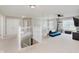 Upstairs bonus room with natural light, a ceiling fan, and a cozy blue couch at 1715 Foudray S Cir, Avon, IN 46123