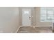 Bright entryway featuring a white front door with decorative glass, neutral walls, and wood-look flooring at 1715 Foudray S Cir, Avon, IN 46123