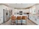 Stylish kitchen with stainless steel appliances, quartz countertops, and seating at the island at 1715 Foudray S Cir, Avon, IN 46123
