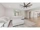 Open-concept living room showcases staircase, modern sofa, and seamless flow to the kitchen at 1715 Foudray S Cir, Avon, IN 46123