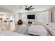 Bright living room featuring a ceiling fan, fireplace, television, and an open floor plan at 1715 Foudray S Cir, Avon, IN 46123