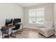 Cozy office space with natural light, neutral walls, a comfortable chair, and wood-look flooring at 1715 Foudray S Cir, Avon, IN 46123