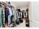 Organized walk-in closet featuring shelves and hanging racks for optimal storage at 1715 Foudray S Cir, Avon, IN 46123