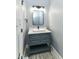 Stylish bathroom with a modern vanity, vessel sink, and sleek lighting fixture at 1723 Fletcher Ave, Indianapolis, IN 46203