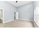 This bedroom has carpet, neutral walls, and an attached bath and closet at 1723 Fletcher Ave, Indianapolis, IN 46203