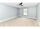 This is an unfurnished bedroom with neutral walls, carpet, and a modern ceiling fan at 1723 Fletcher Ave, Indianapolis, IN 46203