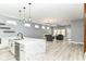A large kitchen island with marble countertop, stainless steel appliances, and opens to the living room at 1723 Fletcher Ave, Indianapolis, IN 46203