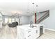 Modern kitchen features marble island, stainless steel appliances, and an open floor plan to the living room at 1723 Fletcher Ave, Indianapolis, IN 46203