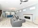 Open-concept living room with modern fireplace flowing into kitchen with large center island at 1723 Fletcher Ave, Indianapolis, IN 46203