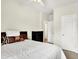 Bright bedroom featuring a queen-sized bed, ceiling fan and a black dresser at 17319 Henslow Dr, Westfield, IN 46074