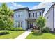 Charming two-story home with well-maintained lawn, lush greenery and a welcoming front porch at 17319 Henslow Dr, Westfield, IN 46074