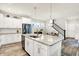 Modern kitchen boasts stainless steel appliances, a spacious island with granite countertops and ample cabinet space at 17319 Henslow Dr, Westfield, IN 46074