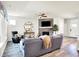 Cozy living room with a stone fireplace, comfortable seating, and ample natural light creating a relaxing ambiance at 17319 Henslow Dr, Westfield, IN 46074