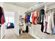 Well-organized walk-in closet with shelves, hanging rods, and access to the bedroom creates a cozy vibe at 17319 Henslow Dr, Westfield, IN 46074